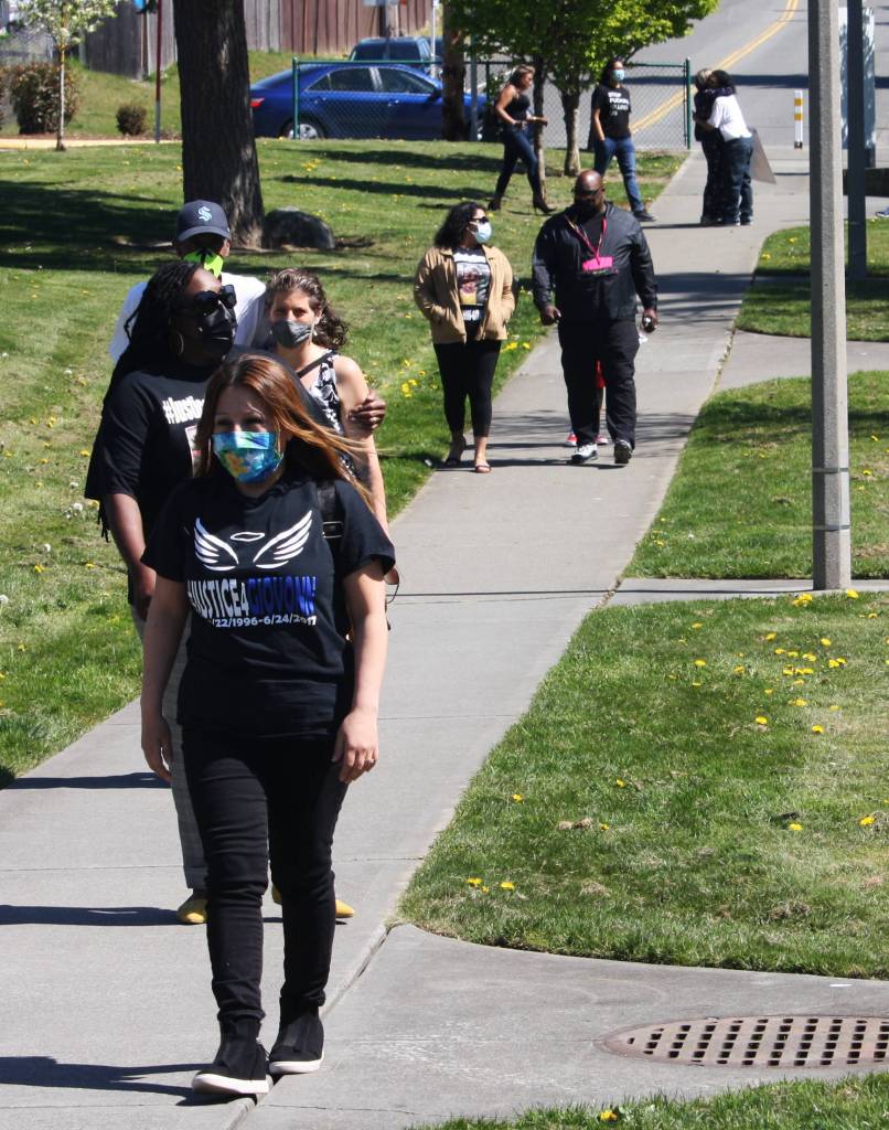 Friends and relatives of Giovonn Joseph-McDade begin to arrive for a press conference April 14 at Canterbury Park in Kent. STEVE HUNTER, Kent Reporter