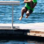 A swimmer dives into Lake Meridian last summer in Kent. FILE PHOTO, Kent Reporter