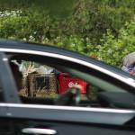 A driver passes shopping carts filled with garbage and personal belongings on South 320th Street on June 16. Olivia Sullivan/Sound Publishing