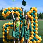Two Kentridge High School graduates celebrate June 19 at the school. COURTESY PHOTO, Kentridge Facebook page