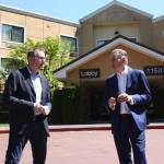 Renton Mayor Armondo Pavone (left) and King County Executive Dow Constantine (right) discuss in front of the newly purchased shelter. CAMERON SHEPPARD, Sound Publishing