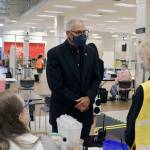 Gov. Inslee (center) meets with Auburn Vaccine Clinic staff member on Tuesday, June 22, 2021. Inslee visited the clinic to promote vaccinations in lower King County. Photo by Henry Stewart-Wood.
