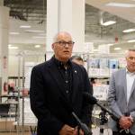 Gov. Jay Inslee (center) gives a speech on the importance of getting vaccinated and to spread awareness of the state's efforts to vaccinate all Washingtonians during his visit to the Auburn vaccine clinic on Tuesday, June 22, 2021. Photo by Henry Stewart-Wood/Auburn Reporter