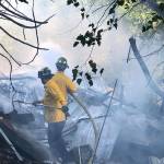 Firefighters take on a fire June 29 at a homeless camp along Frager Road in Kent, about 1 mile south of Meeker Street. COURTESY PHOTO, Puget Sound Fire