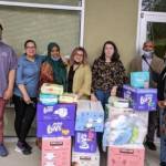 Courtesy photos
On the far right side of the photo, Shamso Issak, director of Living Well Kent, with her staff and the diapers and baby wipes that Kent-AM Kiwanis donated to their organization.