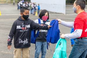 Neely-OBrien Elementary School students receive backpacks filled with supplies from Office Depot on the first day of school Aug. 26 in Kent. COURTESY PHOTO, Kent School District