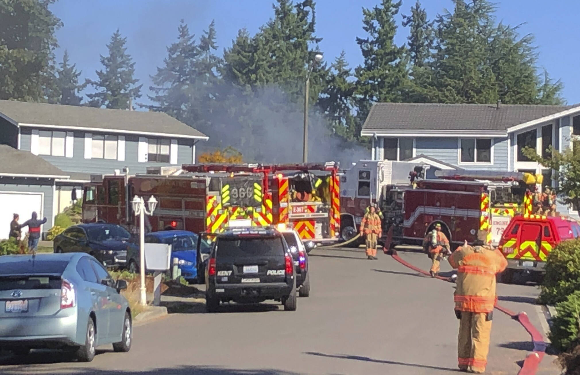 Puget Sound Fire firefighters extinguish a house fire the morning of Friday, Sept. 24 in the 25200 block of 37th Place South on Kents West Hill. COURTESY PHOTO, Puget Sound Fire