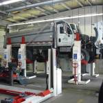 A city of Kent Public Works dump truck undergoing service at the citys maintenance center. The city plans to buy 42 new replacement vehicles in 2022 out of a fleet of 446 vehicles. COURTESY PHOTO, City of Kent