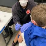 A Tahoma School District student receives a COVID-19 shot Nov. 9 from a Puget Sound Fire employee at Tahoma High School in Maple Valley. COURTESY PHOTO, Puget Sound Fire