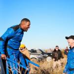 Michael Strahan walks off the New Shepard capsule Dec. 11 in West Texas and is greeted by Blue Origin founder Jeff Bezos after his 10-minute flight into space. COURTESY PHOTO, Blue Origin