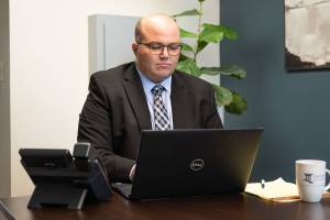 Christian Pearson, attorney at Iddins Law Group in Kent. Call 253-854-1244 or visit iddinslaw.com to request a complimentary phone consultation. Charles Cotugno Photo.