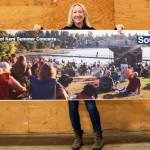 Ronda Billerbeck, city of Kent Cultural Programs manager, shows off the new ad that will be running on King County Metro buses. COURTESY PHOTO, Timothy Aguero Photography