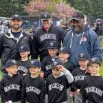 Kent City Council President Bill Boyce, far right, joins the Rockies coaches and players during Kent Little League Day April 30. COURTESY PHOTO, Puget Sound Fire