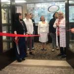 Multi-Service Center (MSC) celebrated its new location in Kent on May 4, including MSC employee Erin Trivelas, far left, MSC CEO Robin Corak, Kent Chamber of Commerce administrative coordinator Lisa Conboy, Kent City Councilmember Satwinder Kaur, MSC board members Maria Tracy and Teleda Holmes, Kent Mayor Dana Ralph and MSC employee Kim Bachrach. COURTESY PHOTO, Multi-Service Center