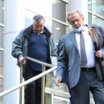 Allan Thomas and his attorney John Henry Browne exit the U.S. District Court building in Seattle following his conviction on several of the counts he was charged with in the drainage district trial. Photo by Ray Miller-Still