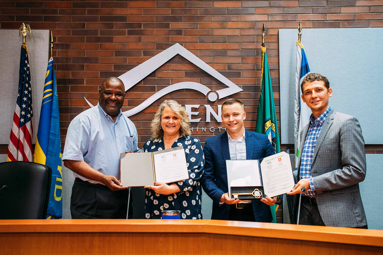 Kent City Council President Bill Boyce (far left), Mayor Dana Ralph, Lutsk, Ukraine Councilmember Roman Kravchuk and Honorary Consulate Gen. Valeriy Goloborodko sign an agreement June 2 to pursue a sister city relationship. COURTESY PHOTO, City of Kent