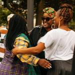 Gwen Allen-Carston, executive director of the Kent Black Action Commission, chats with two women after helping to raise the Juneteenth flag June 15 at Kent City Hall. COURTESY PHOTO, City of Kent