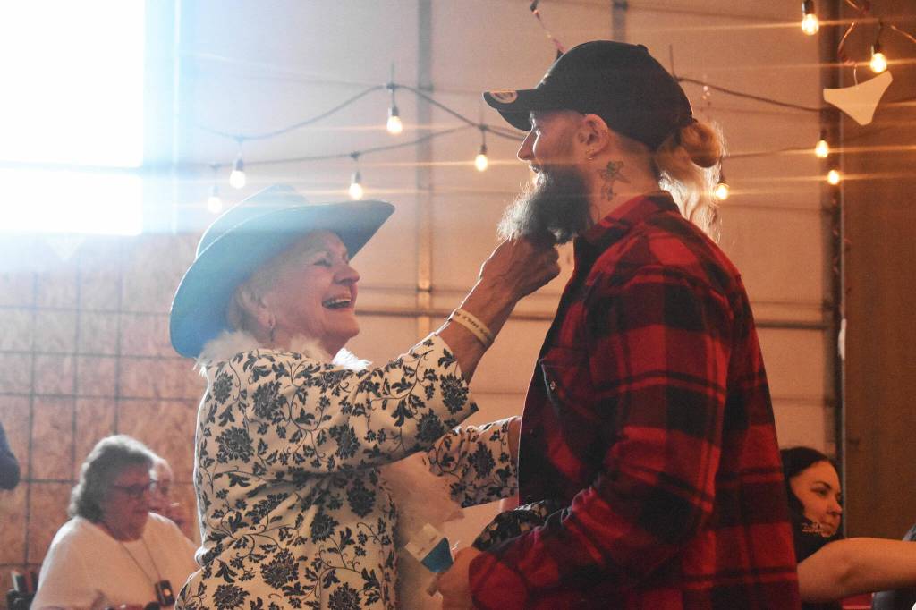 Photo by Alex Bruell
Dorothy Sleigh playfully tugs the beard of one of the Exotic Legends performers.