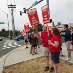Teachers picket this week outside of Kent-Meridian High School during a Kent School District leadership meeting to spread the message that contract negotiations are not going well. COURTESY PHOTO, Kent Education Association