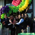 City officials and Amazon Fresh staff help cut the ribbon on opening day of the Amazon Fresh store.