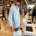 A customer scans their Amazon app to exit the store. Olivia Sullivan/the Mirror