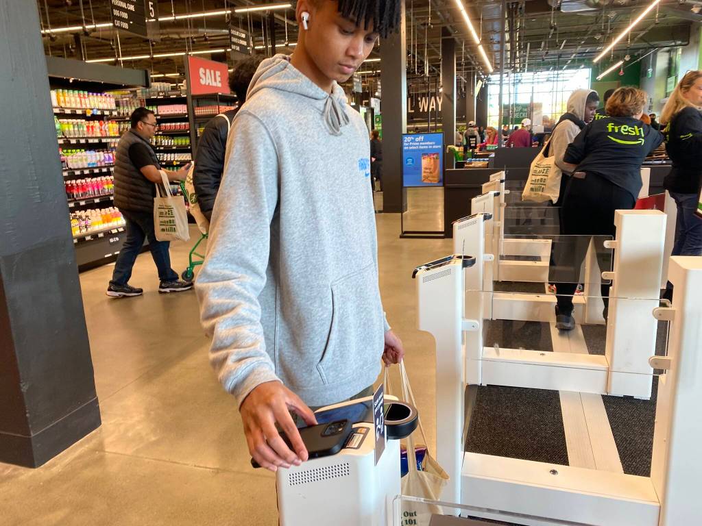 A customer scans their Amazon app to exit the store. Olivia Sullivan/the Mirror