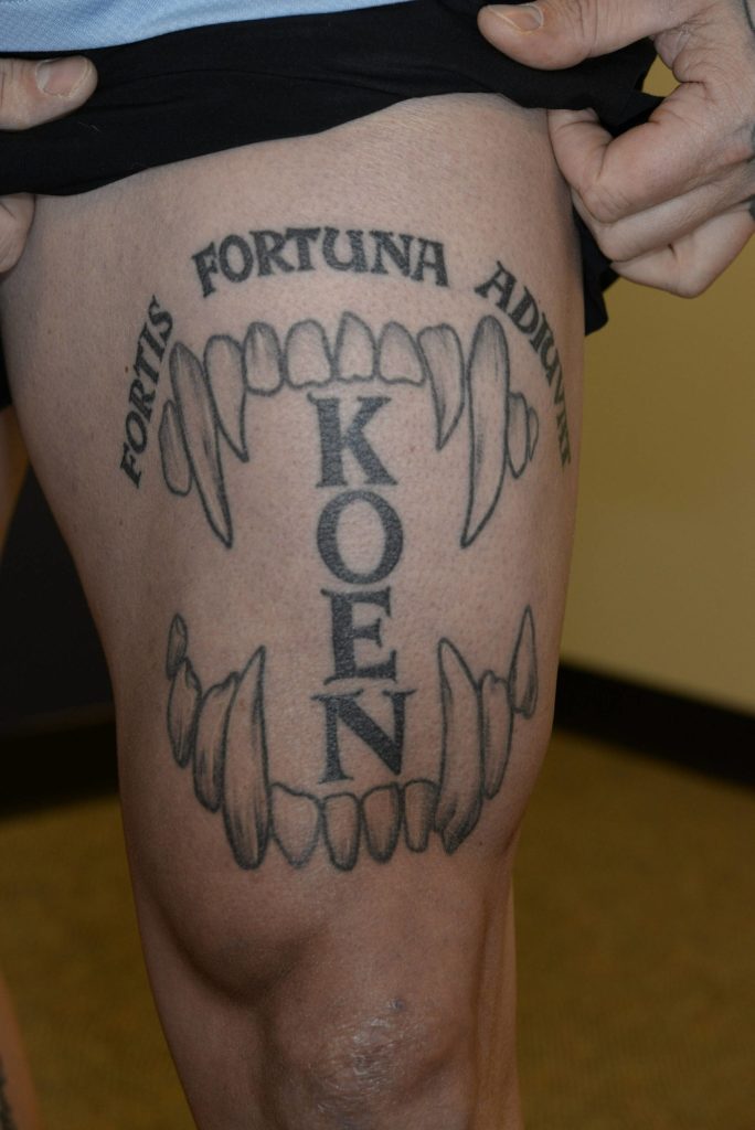 Photo of Nelsons thigh shows a tattoo of Jeff Nelsons Auburn Police K9s name Koen set in between canine teeth and a Latin phrase which translates to fortune favors the bold. These photos were taken by the FBI after Nelson was charged with murder. Courtesy photo
