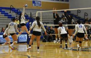 Federal Ways Madison Mulipola on the attack in the third set of their match with Kentwood. Photo by Ben Ray/Sound Publishing