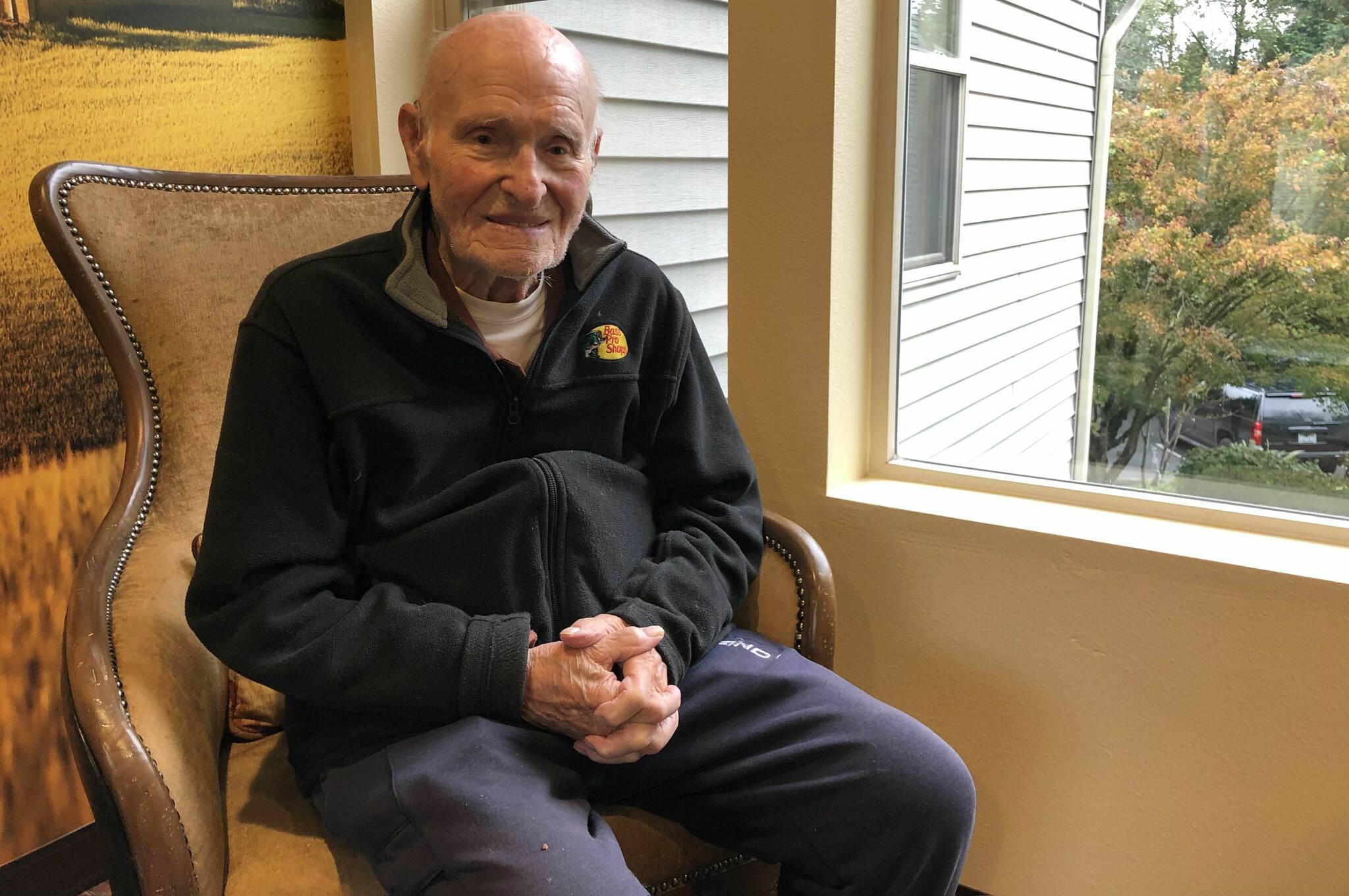 Leo Thoennes sits for a picture near his residence at the Village Green Retirement Campus in Federal Way. Photo by Alex Bruell/the Mirror