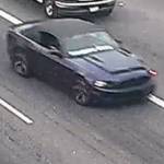 The suspect the shooting of a 9-year-old boy is still at large, last seen driving this dark blue Ford Mustang convertible with white writing on the lower portion of the windshield. Photo courtesy of Washington State Patrol.