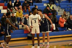 Kent-Meridian senior Jordan Bailey attempting to convince the official for a favorable call for the Royals. Photos by Ben Ray/Sound Publishing