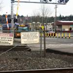 Signs warn pedestrians about crossing the tracks in Kent. STEVE HUNTER, Kent Reporter