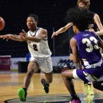 Kentlakes Omari Williams dishes a pass to a teammate. Photo Credit: Ben Ray/ The Reporter