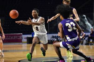 Kentlakes Omari Williams dishes a pass to a teammate. Photo Credit: Ben Ray/ The Reporter