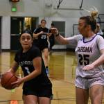 Kentwood senior Tia Pam on her way to the basket. Photo Credit: Ben Ray/ The Reporter