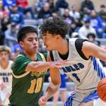 Kentridge senior Dominic Randhawa plays tight defense on a Federal Way player. Photo Credit: Dee Torres