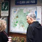Kent Mayor Dana Ralph and King County Executive Dow Constantine check out the map of Clark Lake Park in the 12500 block of SE 240th Street. STEVE HUNTER, Kent Reporter