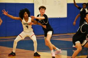 Kent-Meridian senior Tariq Hill and Kentwood junior Blake Stempniak each will be huge contributors to their teams playoff runs. BEN RAY, Sound Publishing