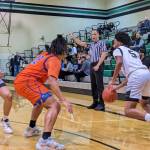Kentwood's Mason St. Louis using a screen from freshman Brandon Tagle. Photos by Ben Ray/The Reporter