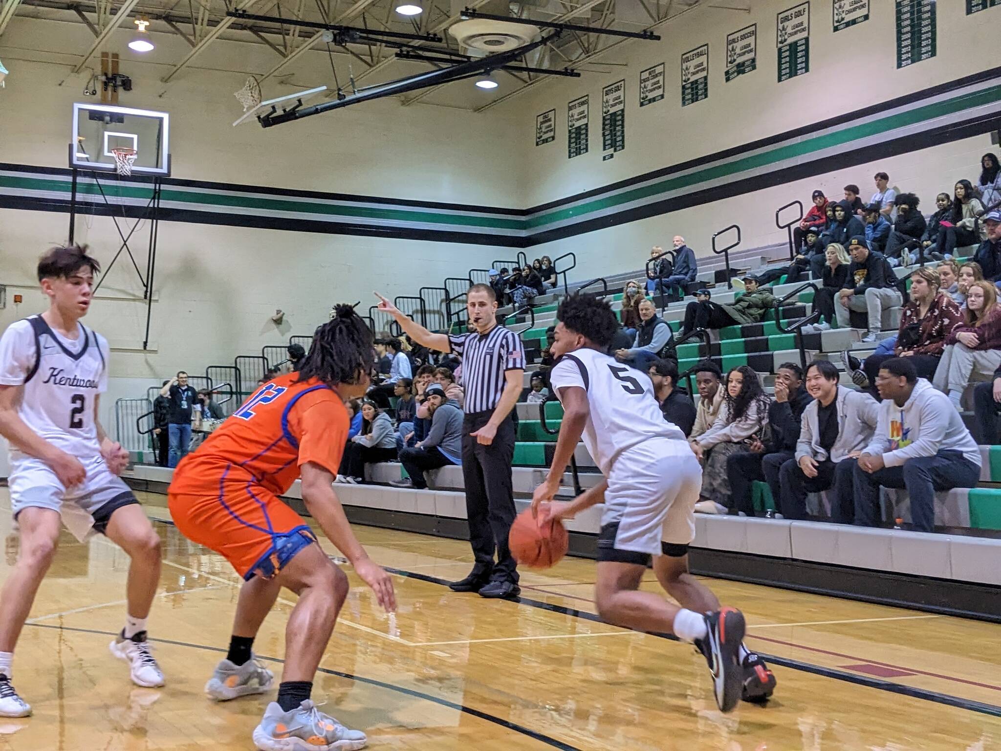 Kentwoods Mason St. Louis using a screen from freshman Brandon Tagle. Photos by Ben Ray/The Reporter
