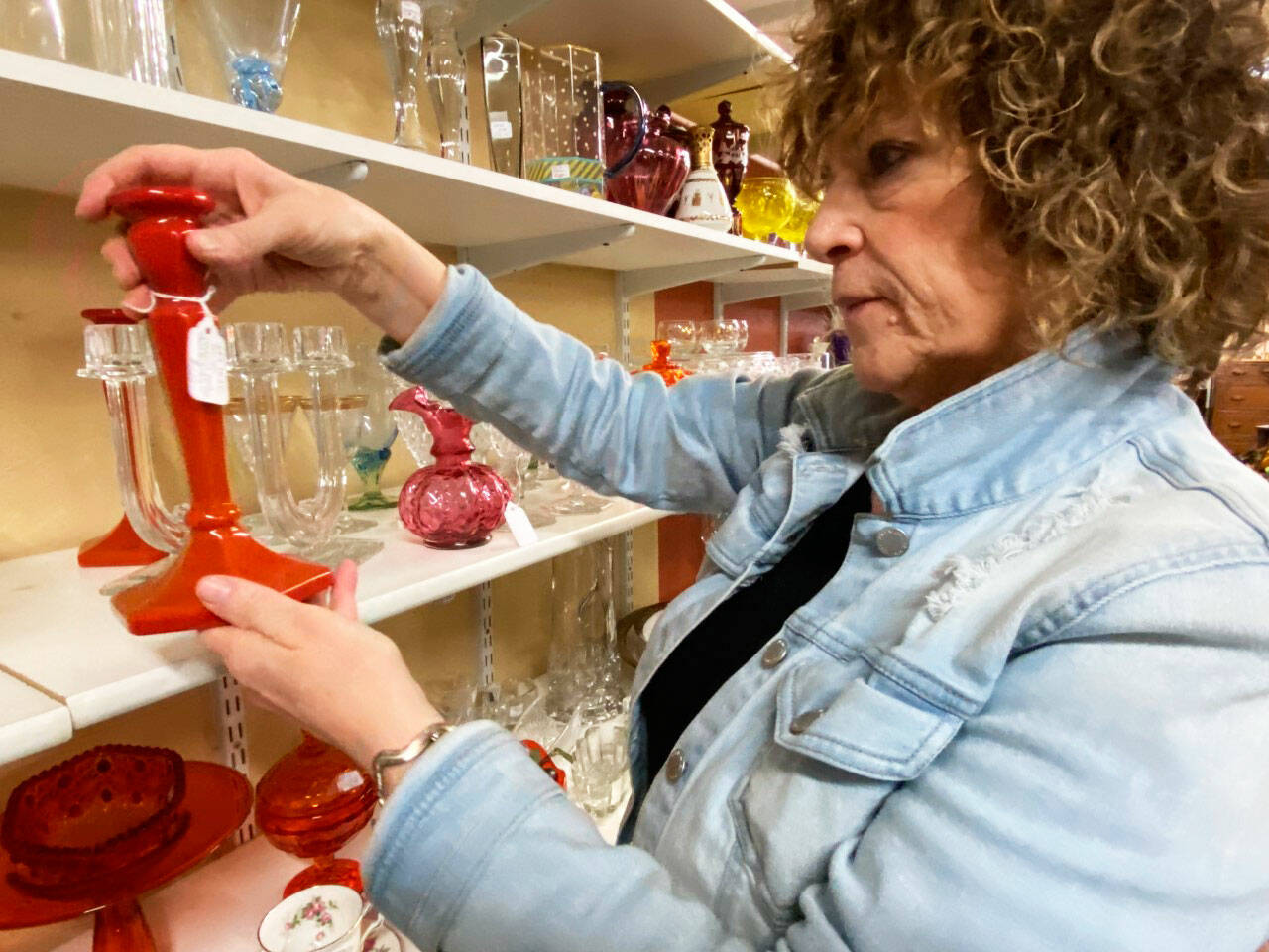 An attendee checks out the displays at a previous Green River Glass Show and Sale. This years show is Saturday, Feb. 25. COURTESY PHOTO, Green River Depression-Era Glass Club