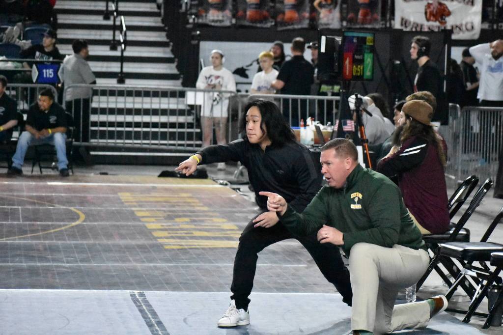 Kentridge staff working with Emilio Tolomei on his second day of competing. Photos by Ben Ray/ The Reporter.