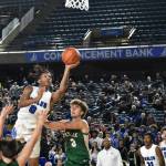 Federal Way senior Vaughn Weems absorbs the contact on his way to the rack. Ben Ray / Sound Publishing