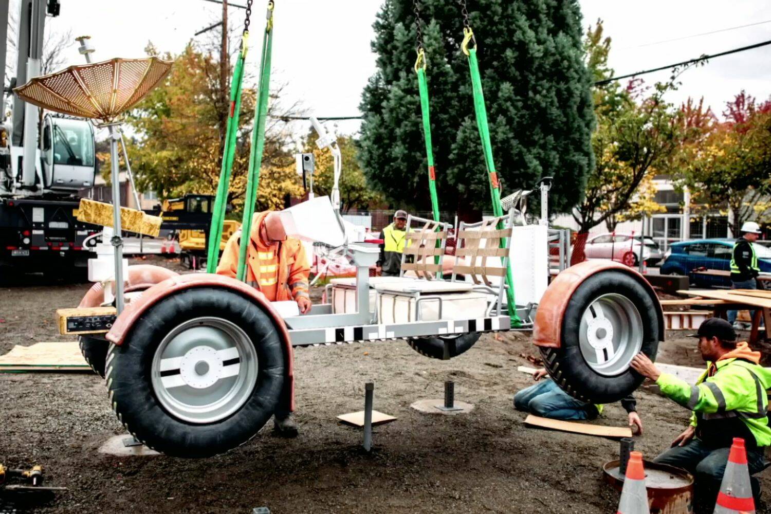 Elements of the citys interactive space-themed park being lowered in. (Screenshot from Kent Youtube page)
