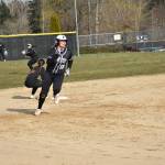 Kentwoods Gabby Greenwood rounds second base on her way to third base for a triple March 16. Ben Ray / The Reporter