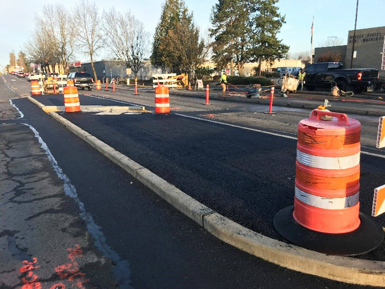 Crews work on a new crosswalk along South 240th Street near the U.S. Post Office. COURTESY PHOTO, City of Kent