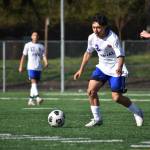Sophomore Irving Baca-Silva takes on a Raider defender in the first half. Ben Ray / The Reporter