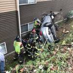 Puget Sound Fire responds to a car that went down an embankment and crashed into the Madison on the River Apartments Thursday morning, April 13. COURTESY PHOTO, Puget Sound Fire