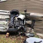 Two people inside the car were injured in the April 13 crash into a Kent apartment building at 8711 S. 259th St. Nobody was hurt inside the apartment. COURTESY PHOTO, Puget Sound Fire