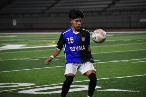 Royals junior Saul Rodriguez looks to control the ball late in the game against the Ravens. Ben Ray / The Reporter